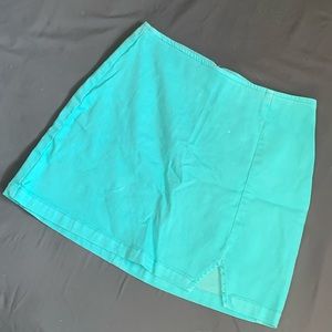 Bright teal, short pencil skirt. It’s a size six